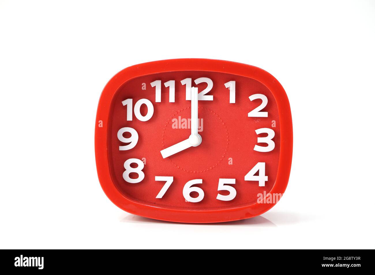 red alarm clock isolated on white background Stock Photo - Alamy