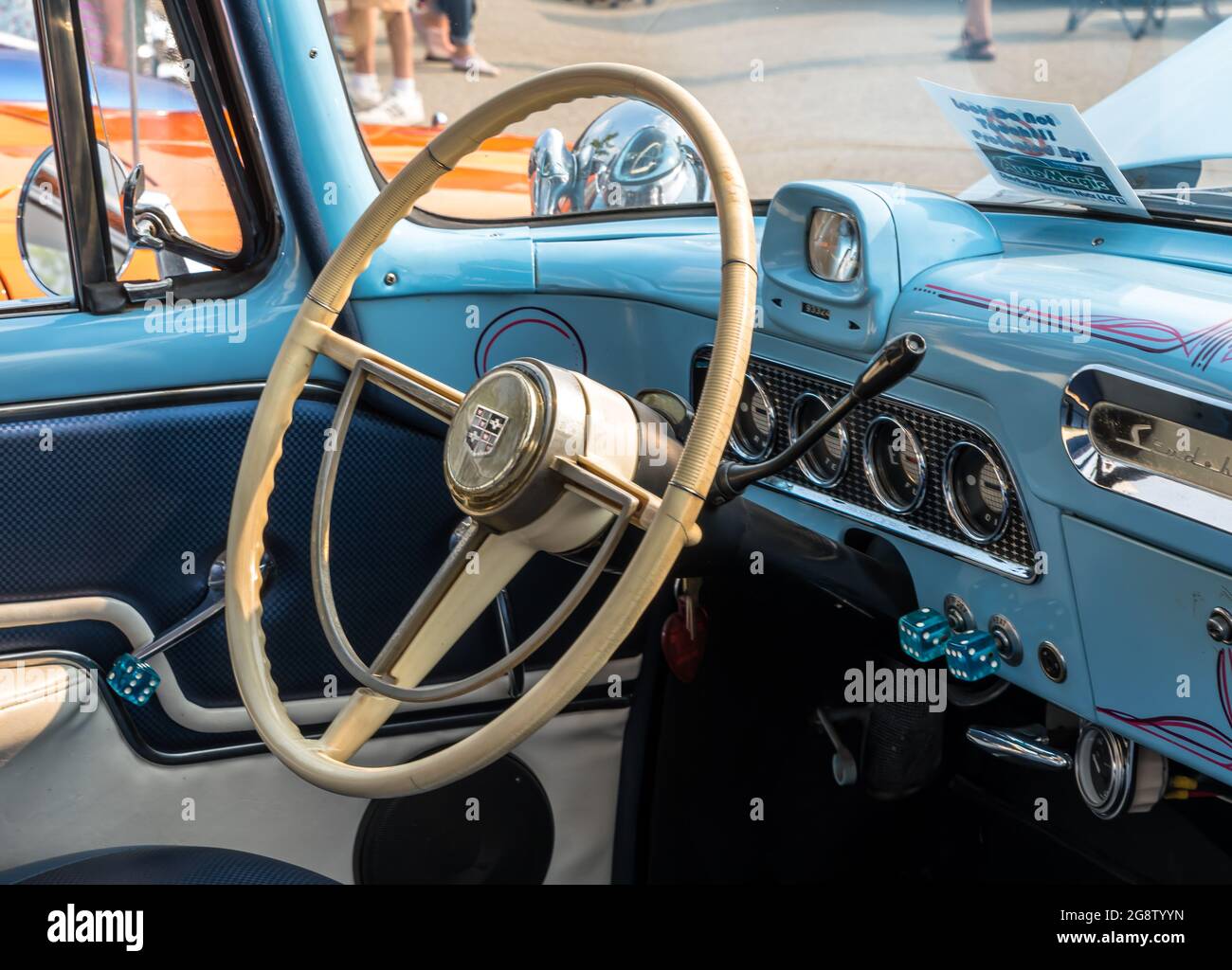 The steering wheel and dashboard of an older blue Studebaker at a car show in Homestead, Pennsylvania, USA Stock Photo