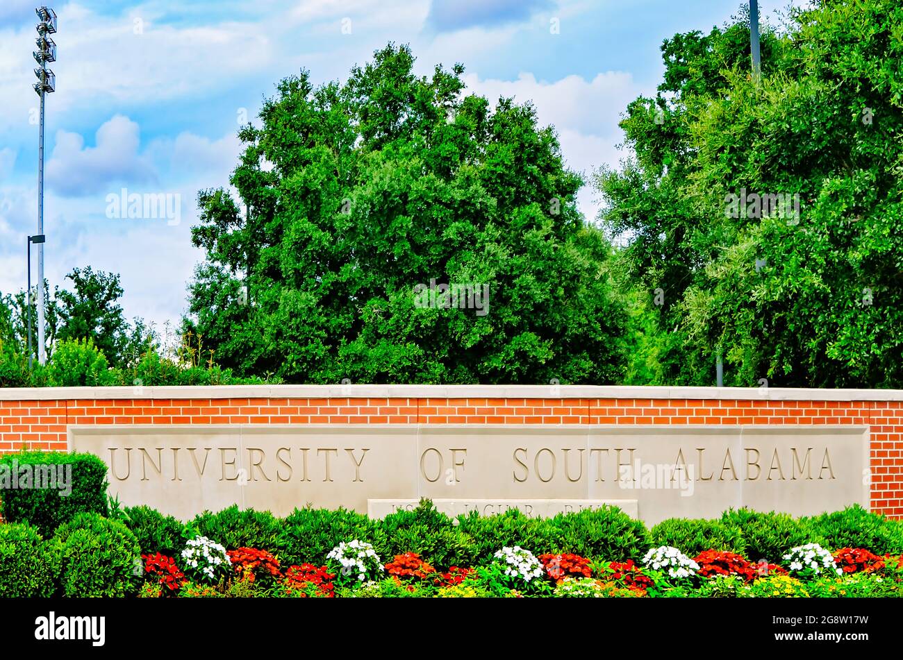 The University of South Alabama entrance sign is accented with flowers, July 20, 2021, in Mobile, Alabama. Stock Photo