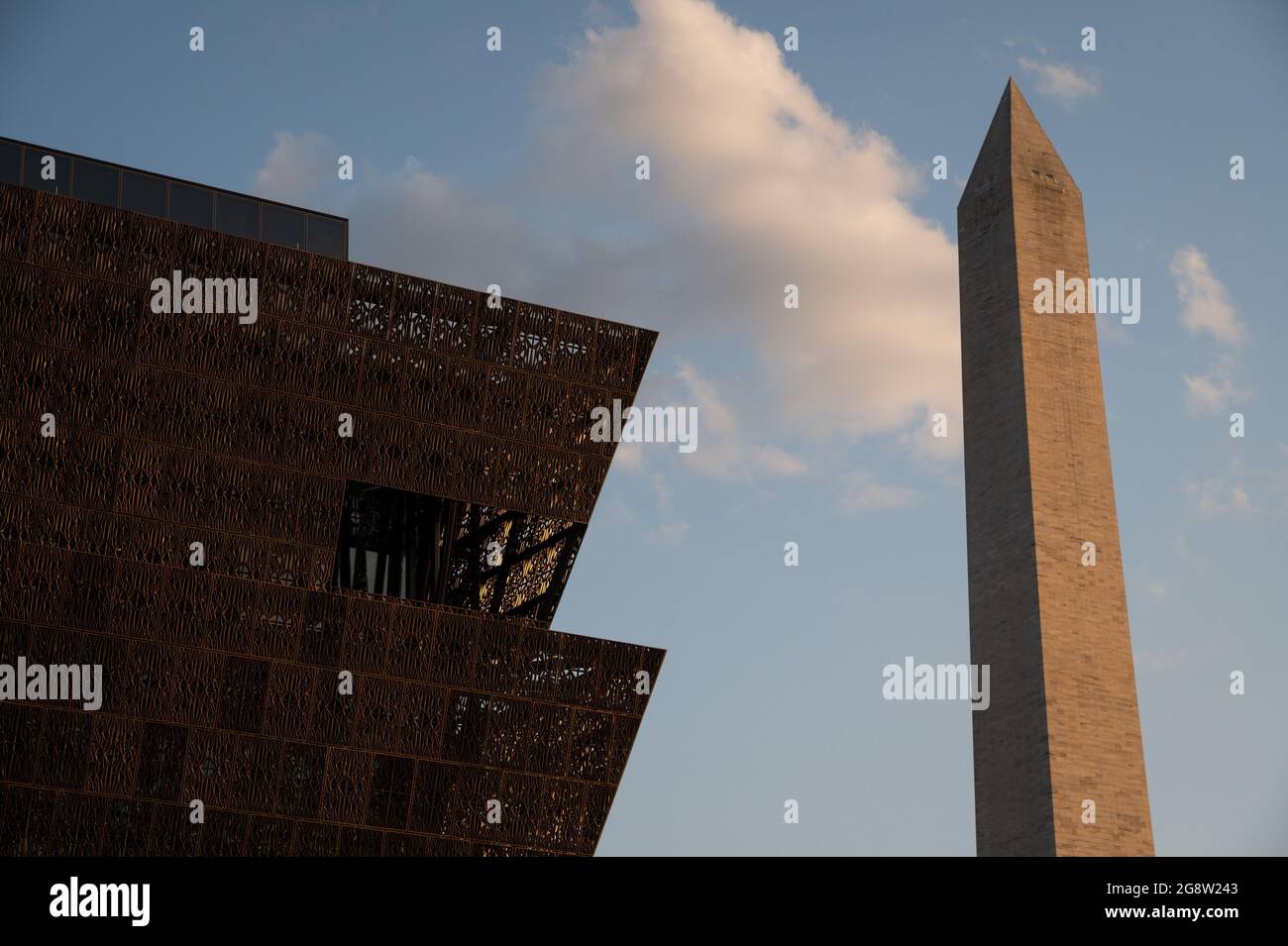 Washington, USA. 23rd July, 2021. A general view of the Smithsonian National Museum of African American History and Culture and the Washington Monument, in Washington, DC, on Thursday, July 22, 2021, amid the coronavirus pandemic. As the Delta variant of COVID-19 spreads rapidly in the America and around the world, this week in Washington negotiations over infrastructure legislation have continued in Congress. (Graeme Sloan/Sipa USA) Credit: Sipa USA/Alamy Live News Stock Photo