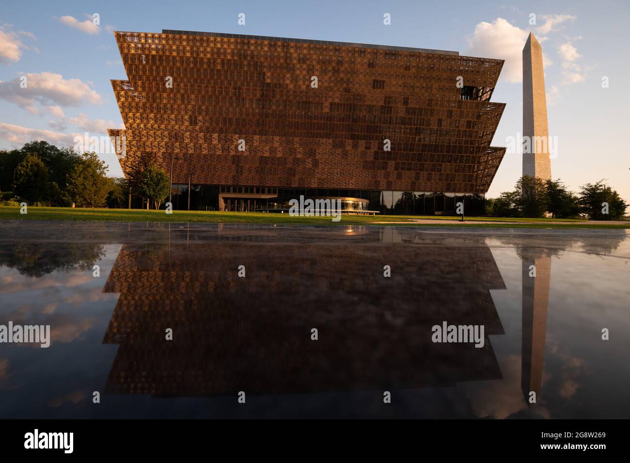 Washington, USA. 23rd July, 2021. A general view of the Smithsonian National Museum of African American History and Culture and the Washington Monument, in Washington, DC, on Thursday, July 22, 2021, amid the coronavirus pandemic. As the Delta variant of COVID-19 spreads rapidly in the America and around the world, this week in Washington negotiations over infrastructure legislation have continued in Congress. (Graeme Sloan/Sipa USA) Credit: Sipa USA/Alamy Live News Stock Photo