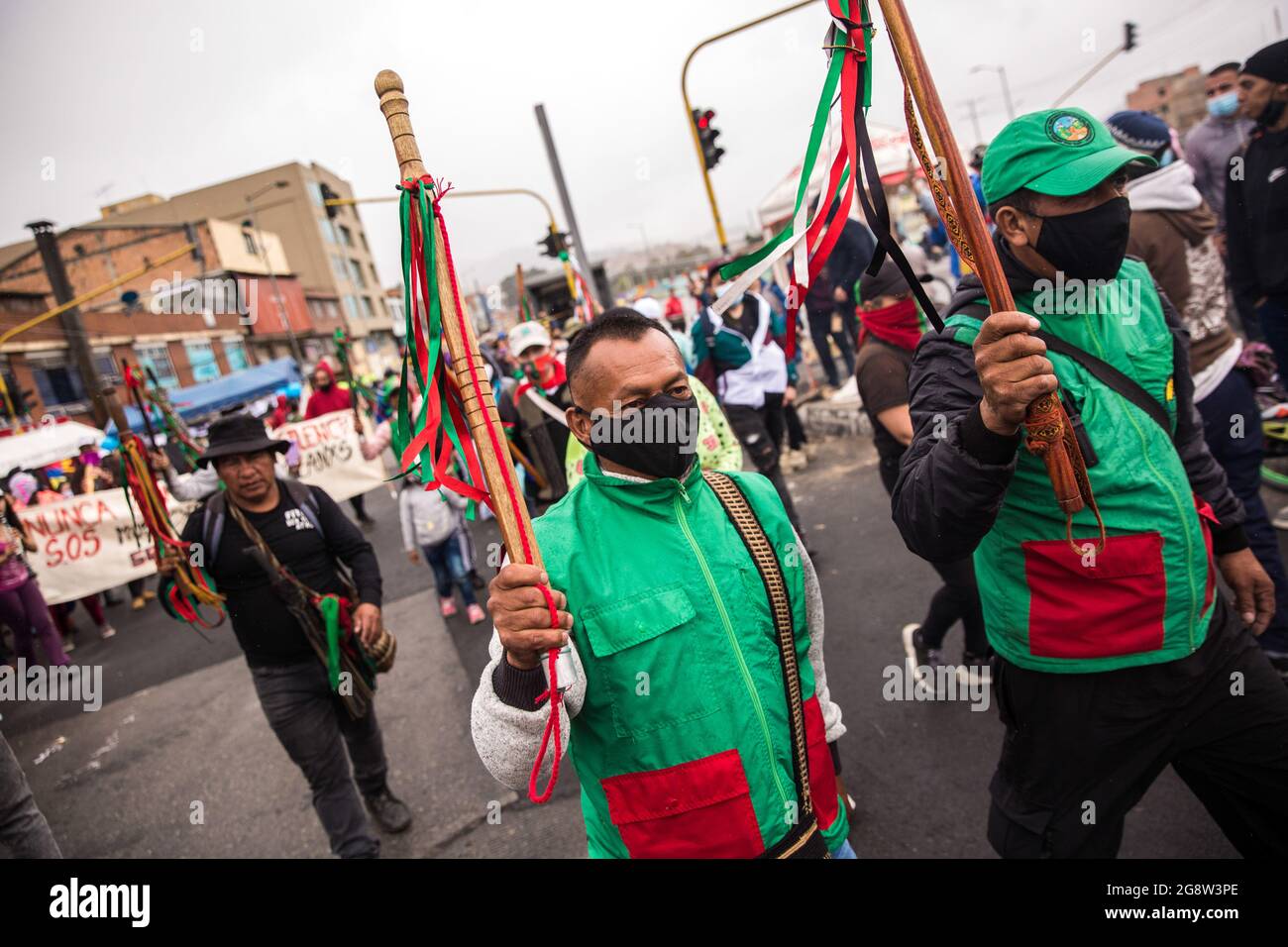 July 20, 2020, BogotÃ, Colombia: Members of the indigenous guard march along one of the points of resistance in the capital.The indigenous guard arrives in BogotÃ on July 20th, Colombia's Independence Day, to support the protests. The day began with a press conference in front of the CRIC (Cauca Regional Indigenous Council), where also members of the frontline participated, during the day two traditional buses, that the indigenous groups used for transport drove all over the resistance points of the capital, where the protests were taking place. (Credit Image: © Antonio Cascio/SOPA Images via Stock Photo