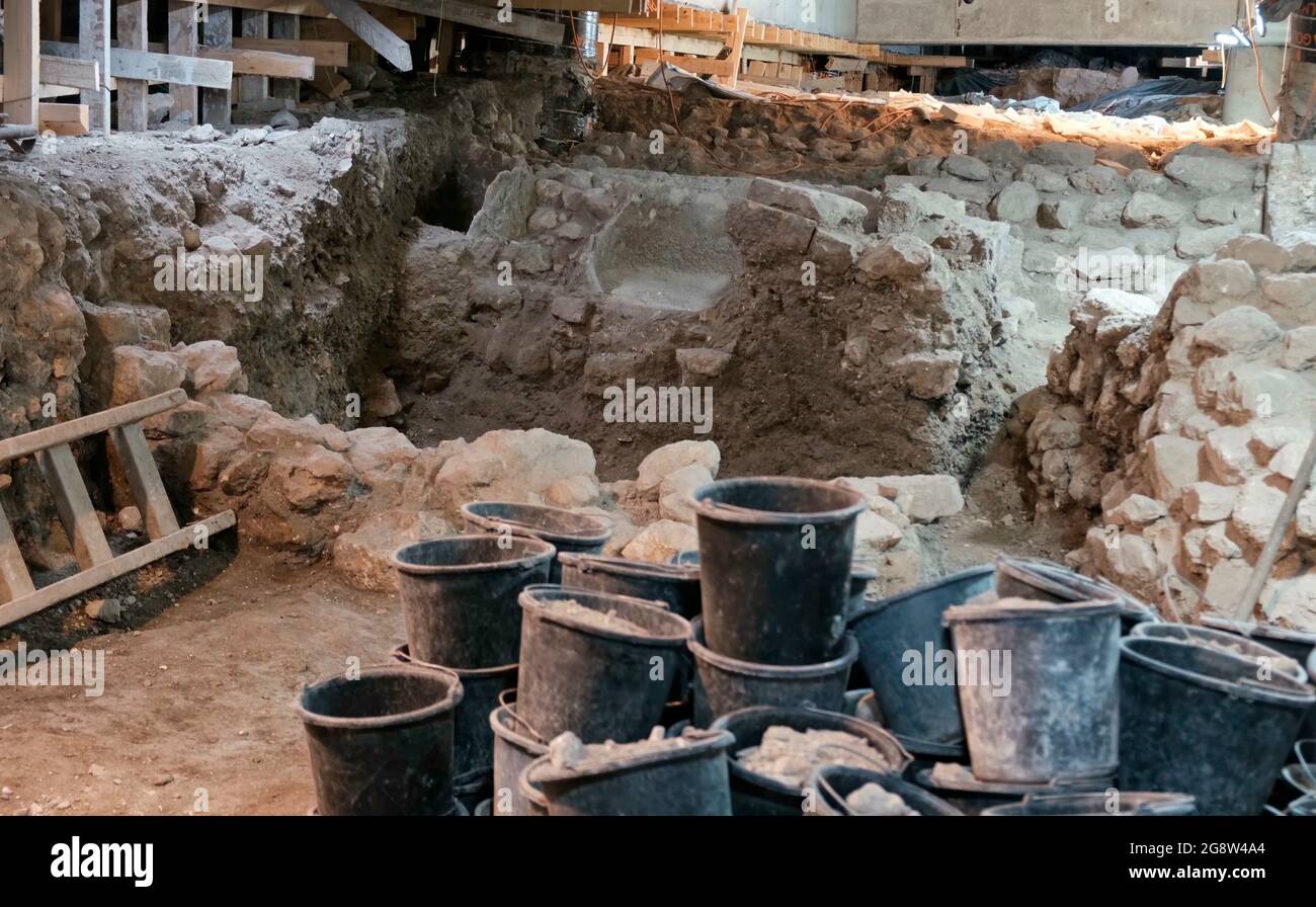 Excavations carried out near the site of a Second Temple period (516 BC-AD 70) public building, that has ever been uncovered outside the Temple Mount walls on July 21, 2021, in Jerusalem, Israel. Israeli archaeologists unveiled new parts of a major public building just metres from where the Second Jewish Temple is believed to have stood two millennia ago. The opulent hall used by notable members of society on their way to worship is the latest discovery to be made public by the Israeli Antiquities Authority (IAA) from what it refers to as the Western Wall Tunnels. Stock Photo