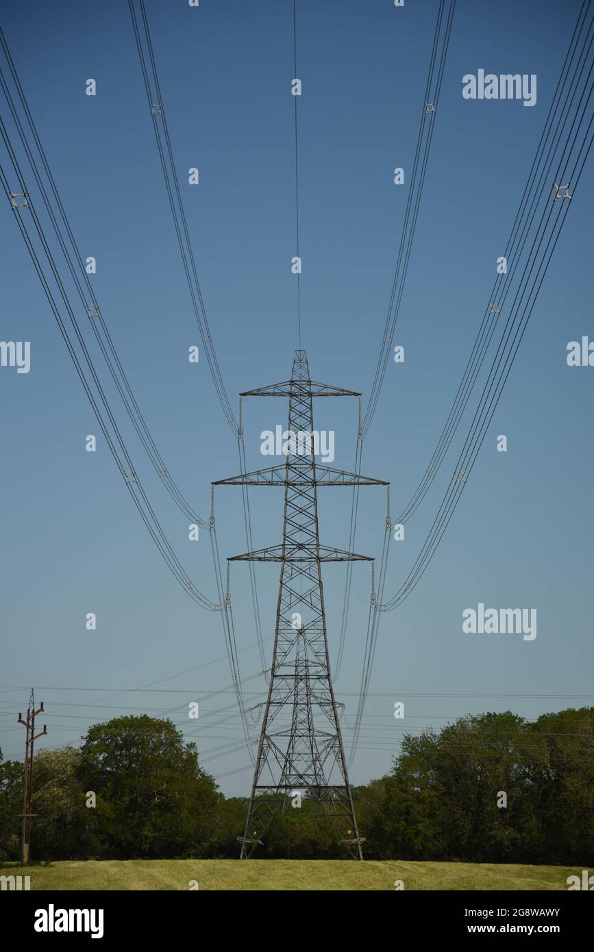electric power cables against a blue sky Stock Photo