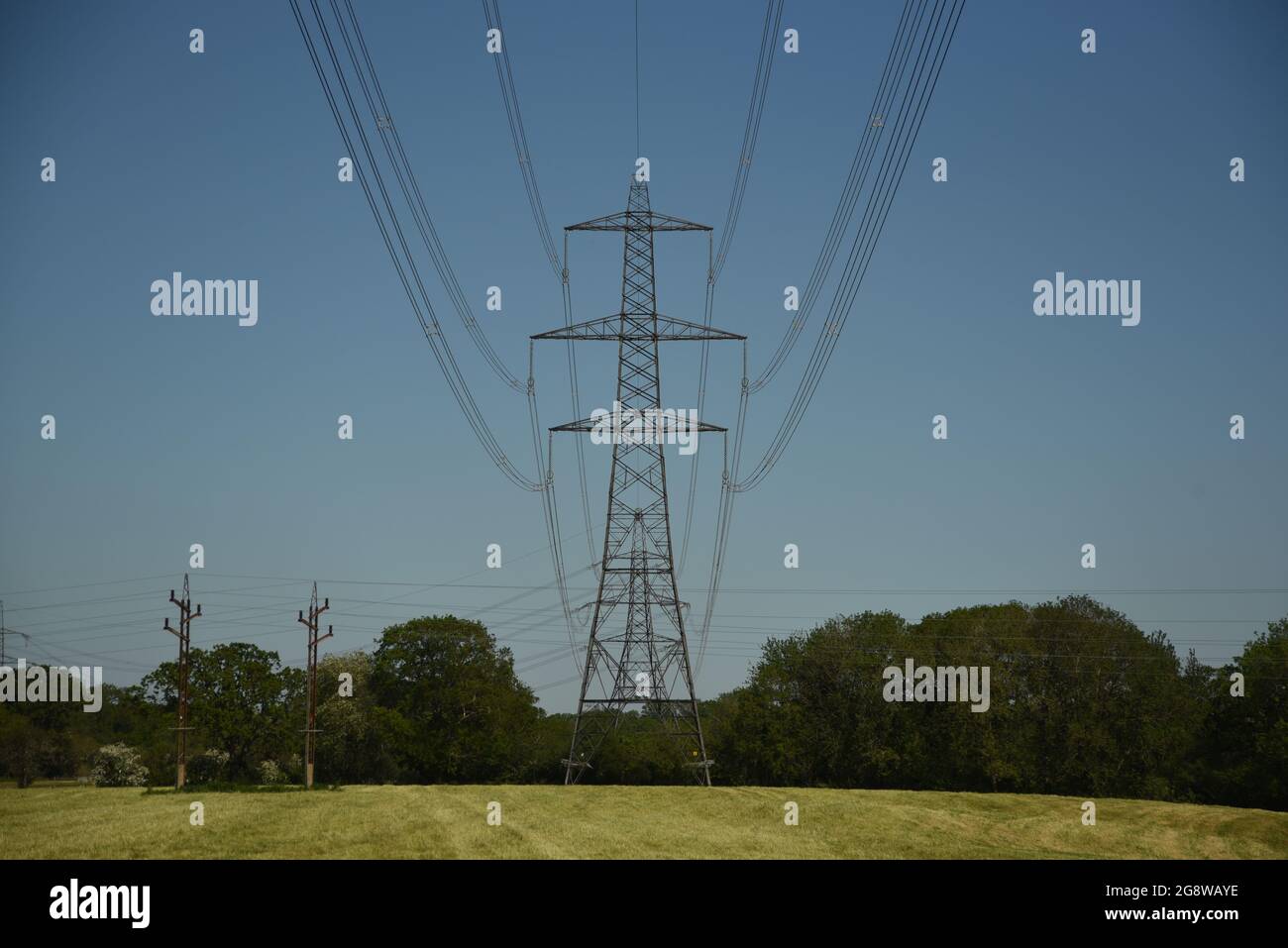 High voltage electrical cable and pylons Stock Photo