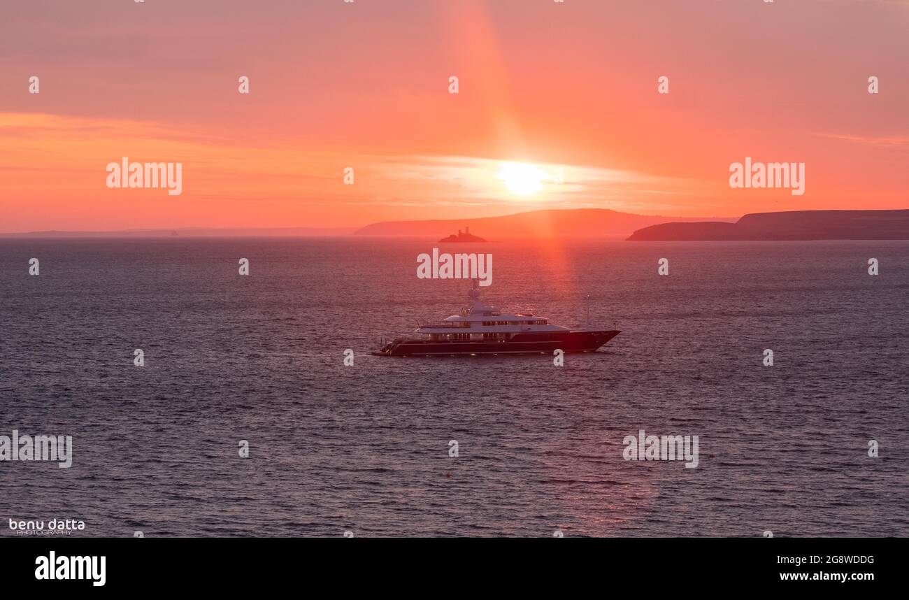 Yacht at sunrise Stock Photo