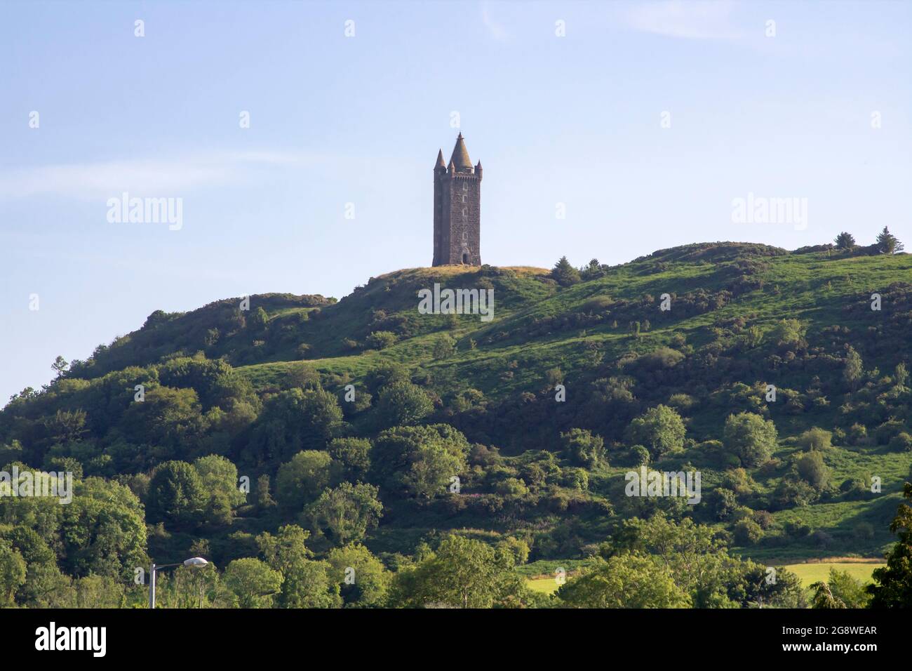 21 July 2021 The Scrabo Tower Monument built on Scrabo Hill  dominating the skyline of Newtownards in County Down Northern Ireland Stock Photo