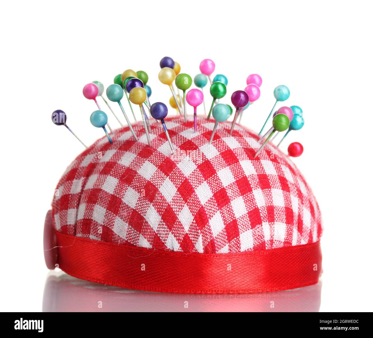 Colored pinheads in pincushion isolated on white Stock Photo Alamy