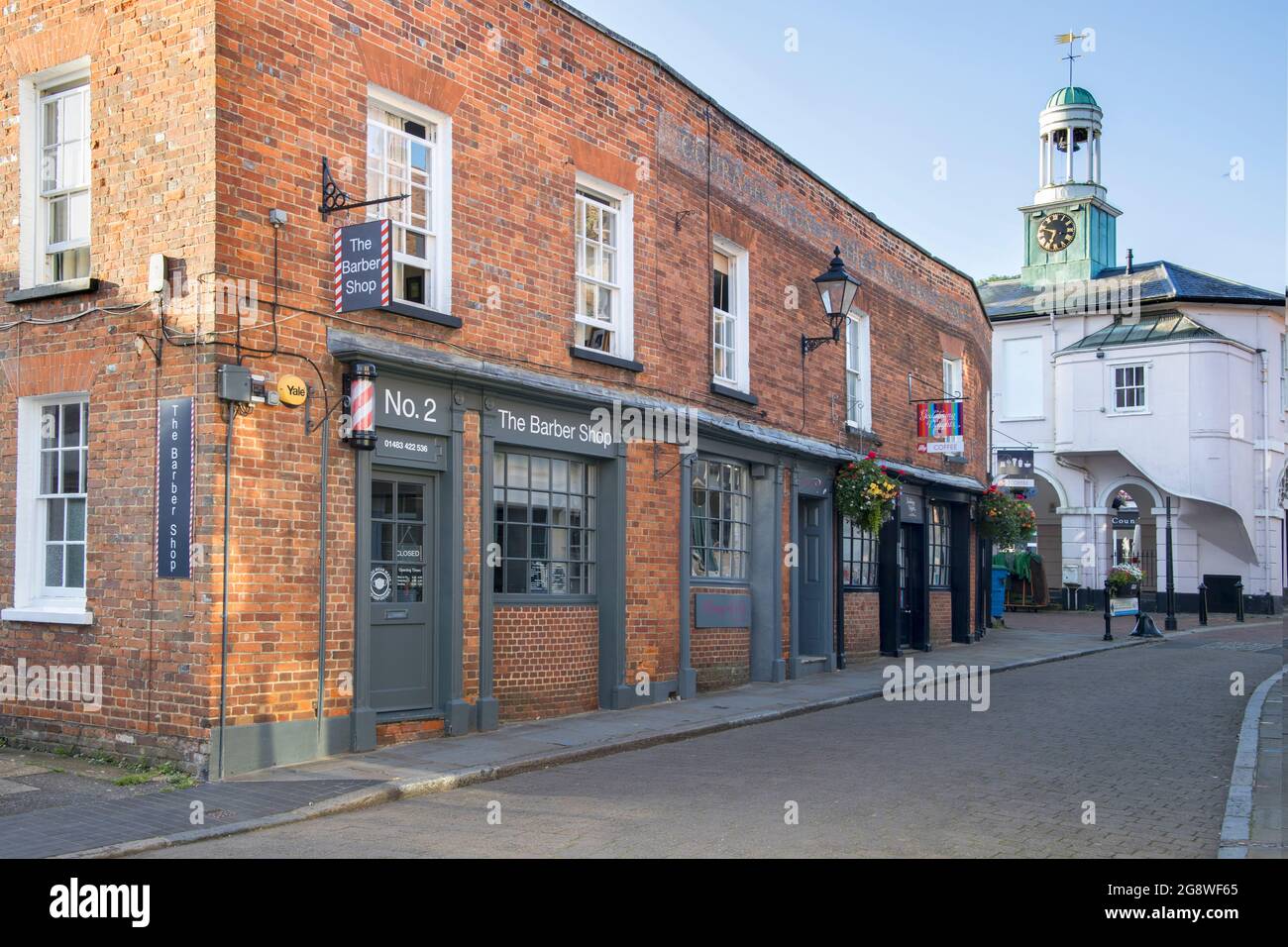 barbers shop in church street with the pepperpot in the background in godalming town centre