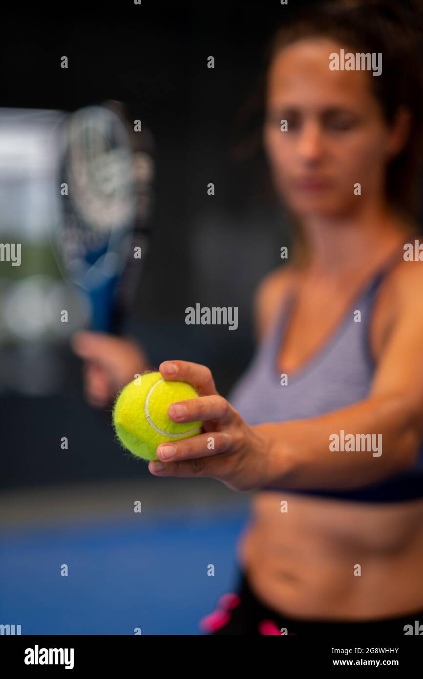 Padel tennis player ready to make the service Stock Photo