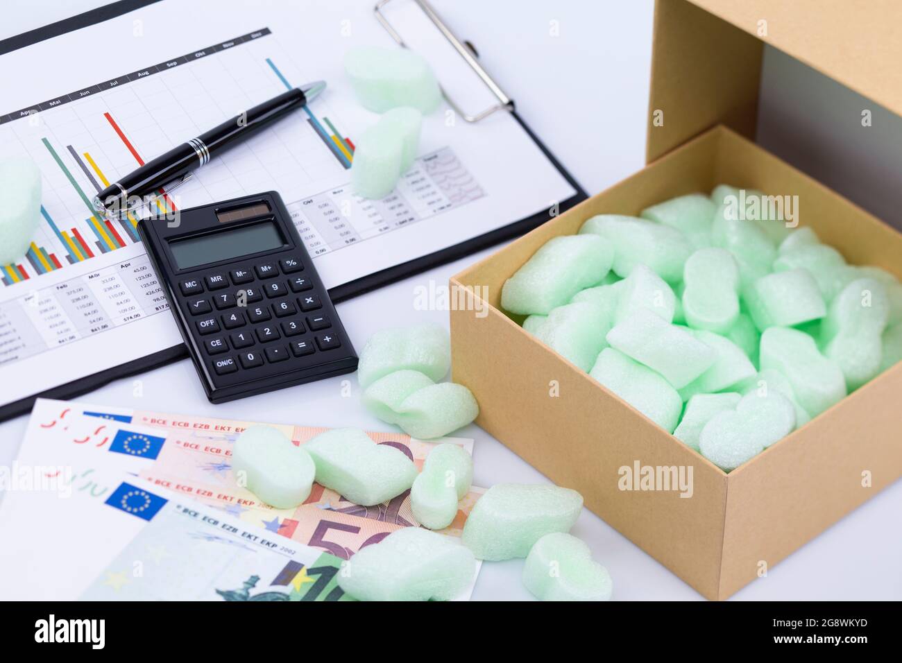 The image shows an opened package with styrofoam snippets with