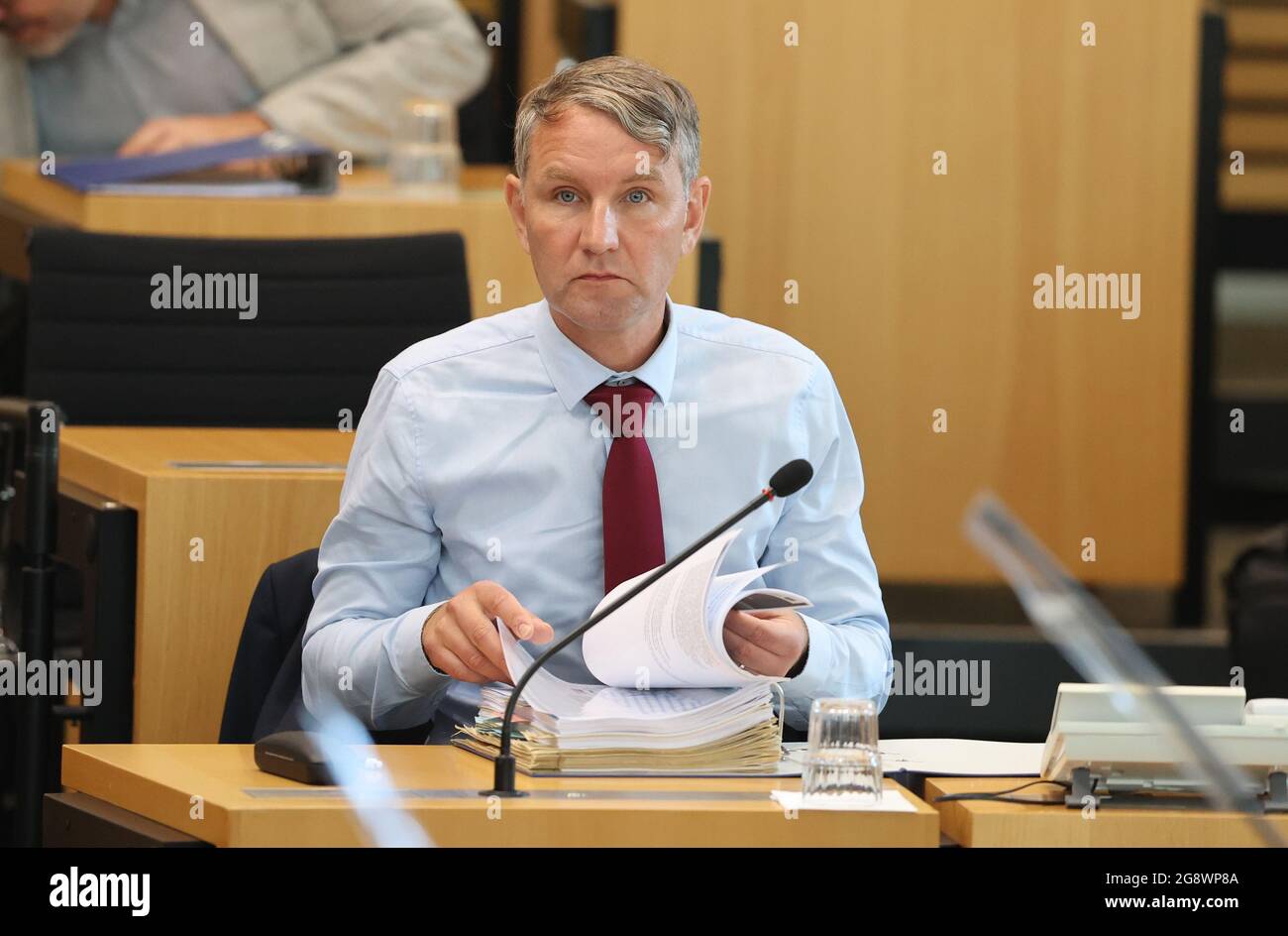 Erfurt, Germany. 23rd July, 2021. Björn Höcke, parliamentary group leader  of the AfD, sits in the plenary hall of the Thuringian state parliament. At  the request of the AfD faction, Thuringia's left-wing