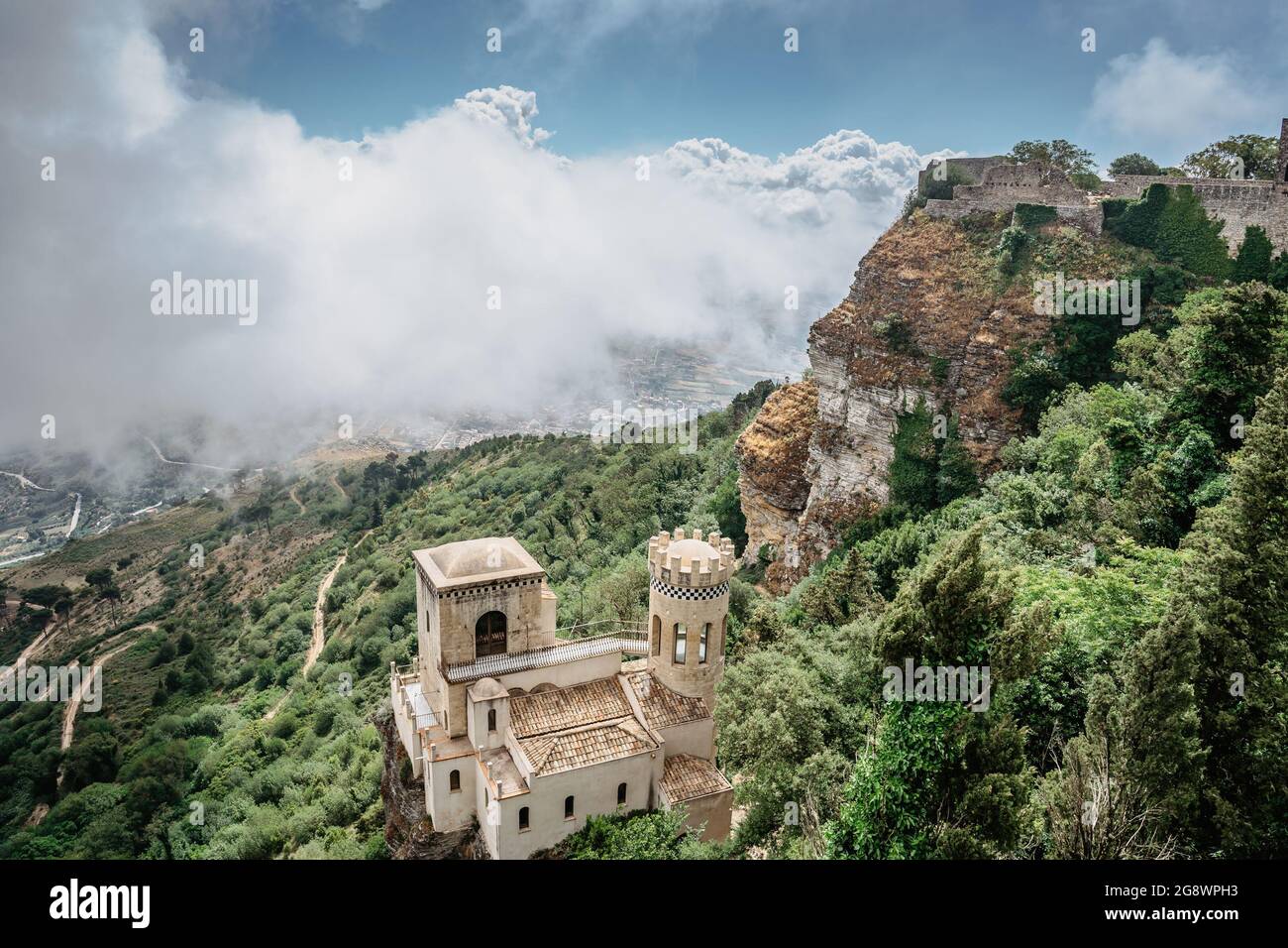 Erice,Sicily,Italy.Historic town on the top of mountains overlooking beautiful lush countryside.View of Venus Castle,Castello di Venere, in clouds. Stock Photo
