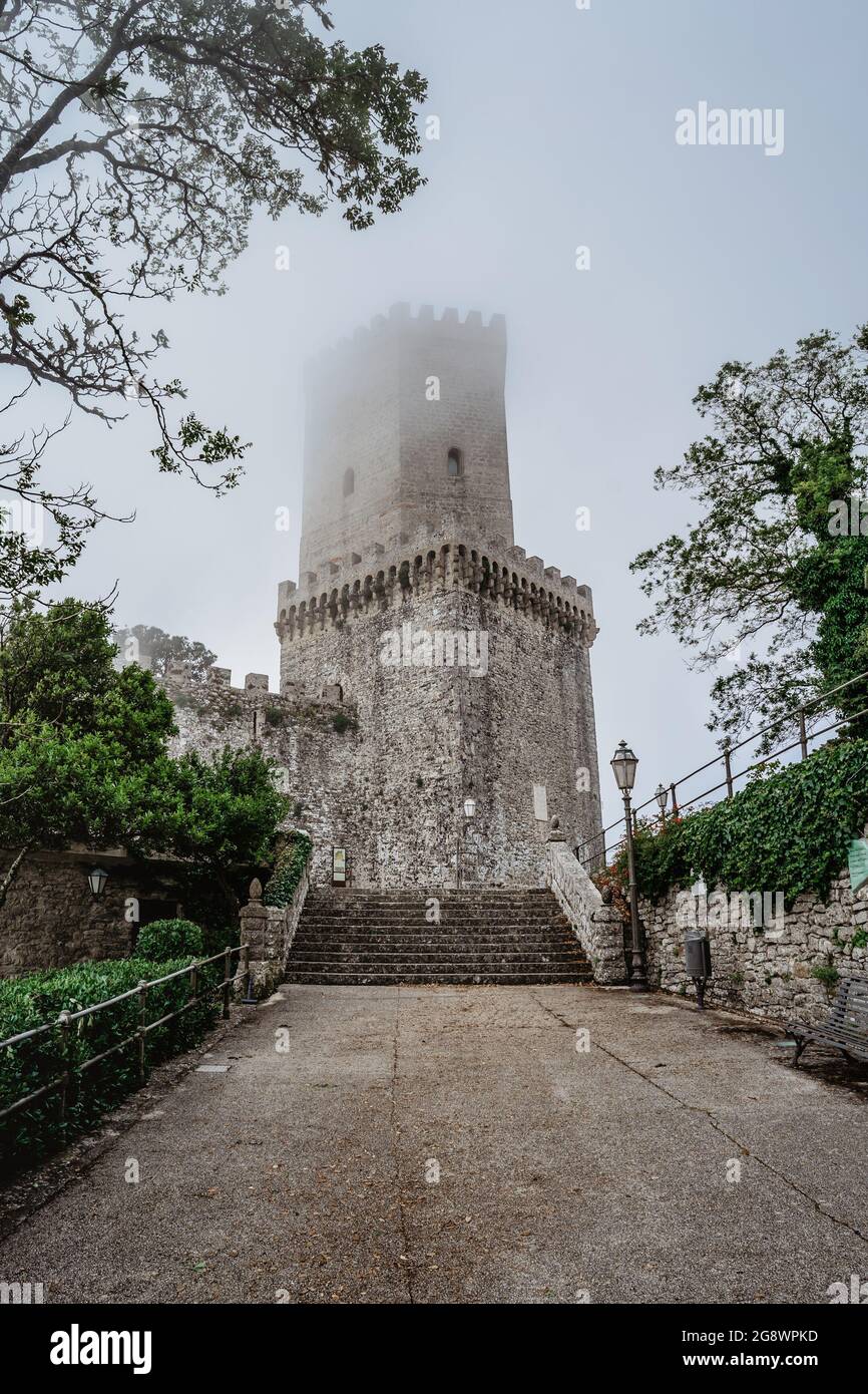 Erice,Sicily,Italy.Historic town on the top of mountains overlooking beautiful lush countryside.View of Venus Castle,Castello di Venere, in clouds. Stock Photo