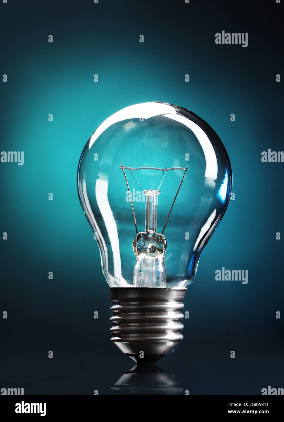 Light bulb on blue background Stock Photo - Alamy
