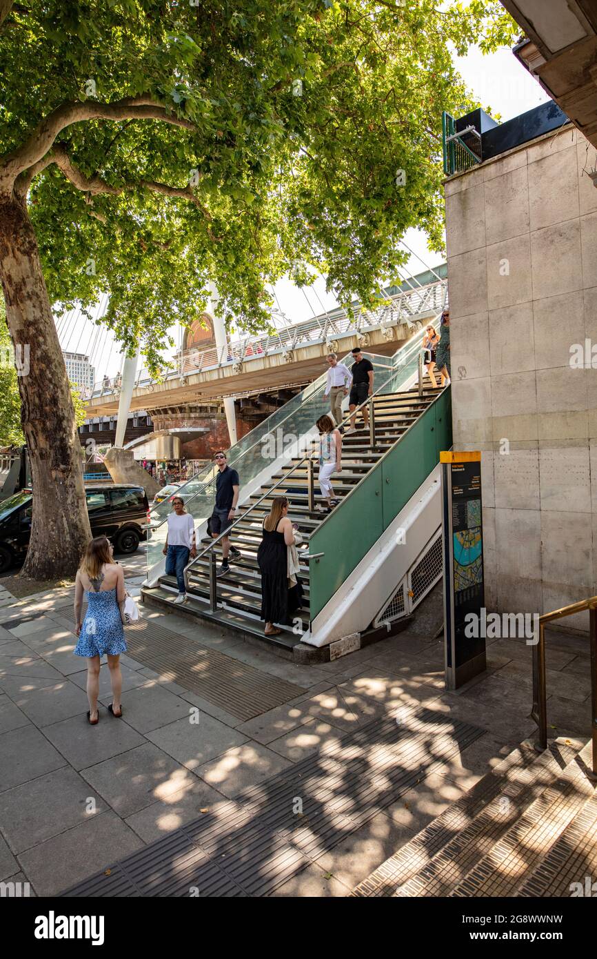 Tourists outside Embankment Station Underground, London; Victoria