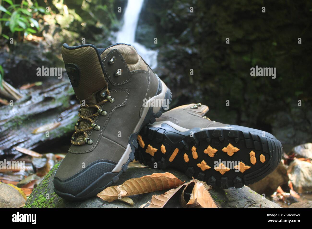 boots with a masculine design for outdoor adventure activities, with jagged soles suitable for tropical and snowy terrain. Stock Photo