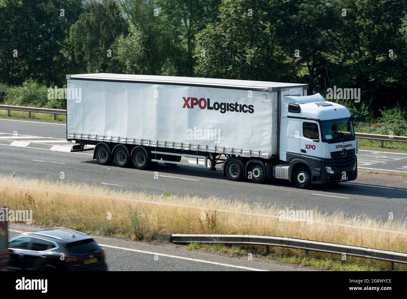 XPO Logistics lorry on the M40 motorway, Warwickshire, UK Stock Photo