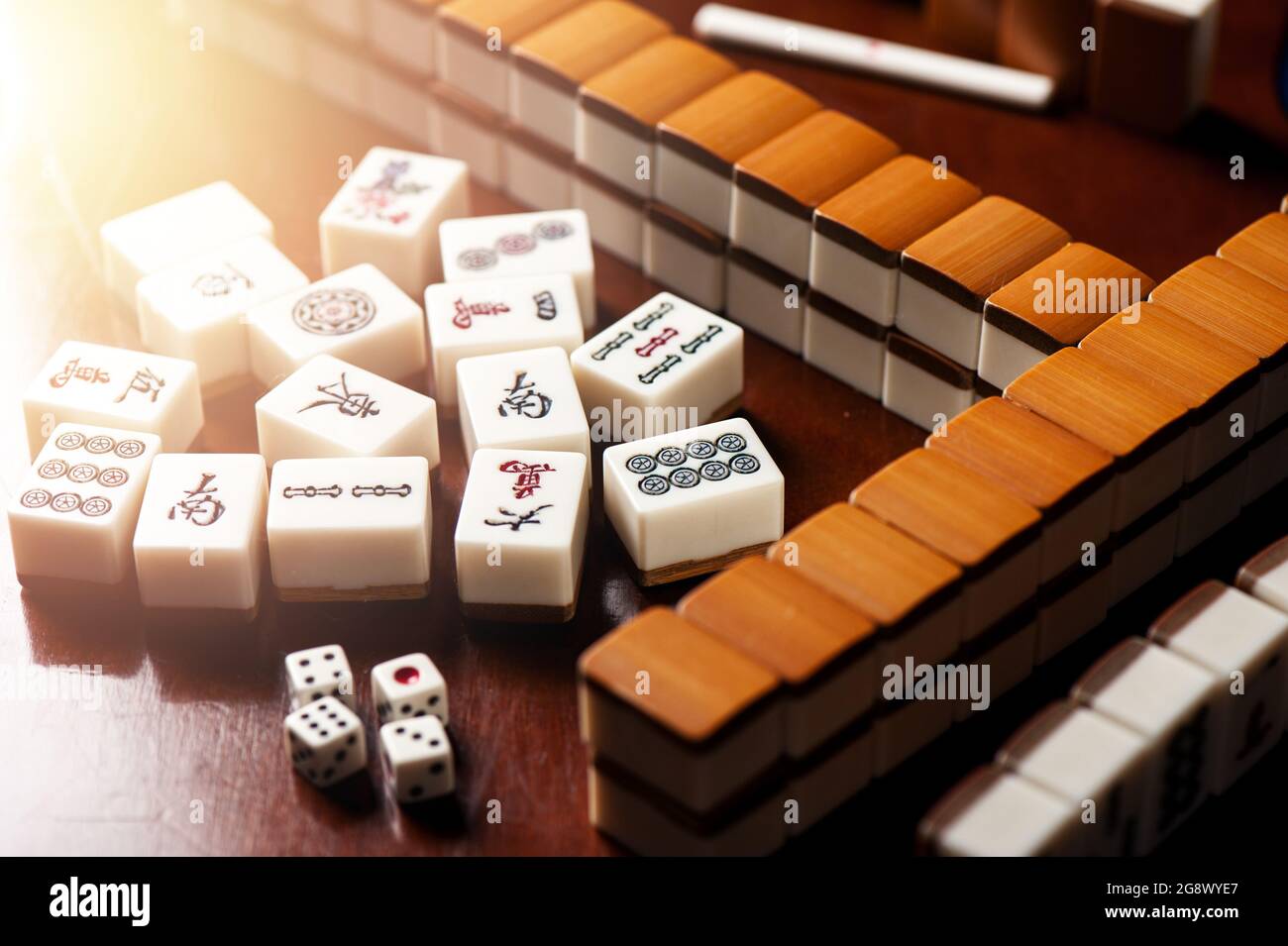 Many old mahjong tiles on wooden table. Mahjong is the ancient asian board  game Stock Photo - Alamy