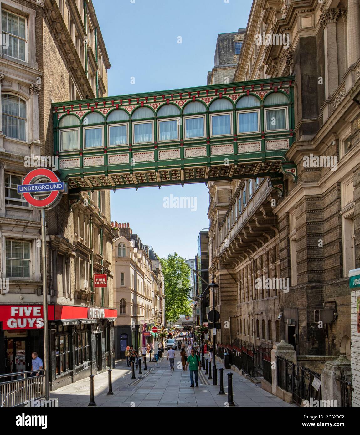York Place, once Of Alley, near Charing Cross, London, UK; a narrow street between Charing Cross and the Strand; a raised walkway between buildings Stock Photo