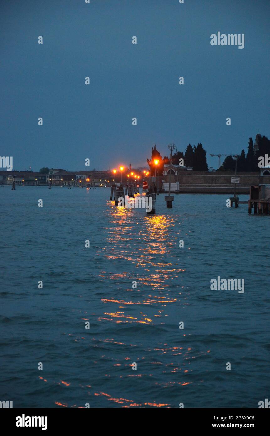 View of the Venice laguna with the lights across the waters Stock Photo