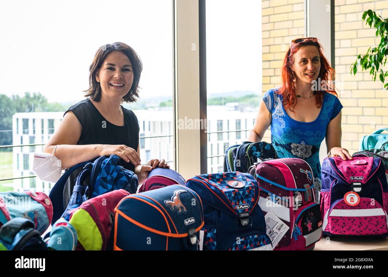 23 july 2021 brandenburg potsdam chancellor candidate annalena baerbock l top candidate of bundnis 90 die grunen in brandenburg and franziska loffler head of the potsdam office kinder ar mut are happy about the school