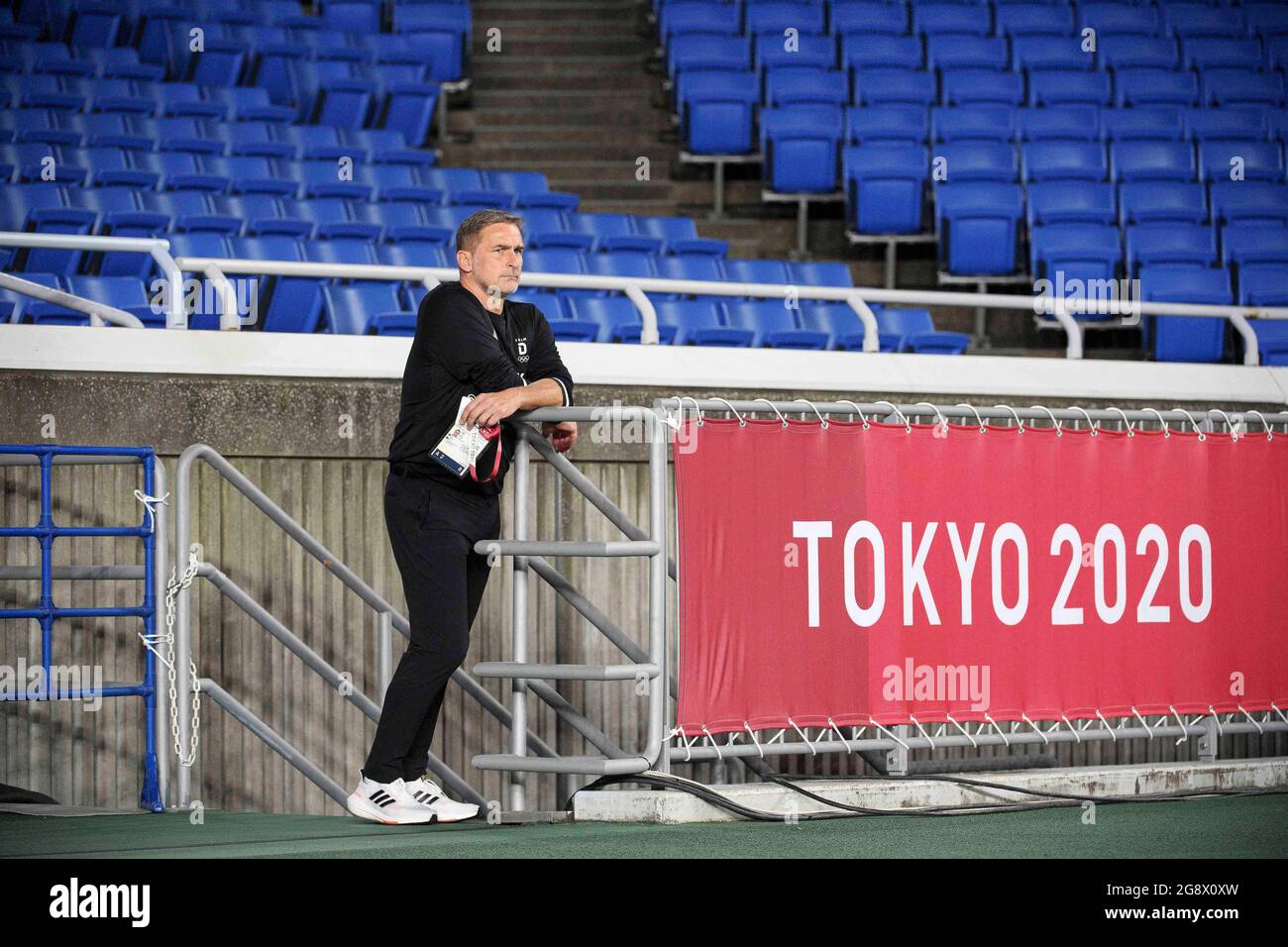 coach Stefan KUNTZ (GER) behind a Tokyo2020 lettering soccer preliminary round of men group D, Brazil (BRA) - Germany (GER), on July 22nd, 2021 in Yokohama. Olympic Summer Games 2020, from 23.07. - 08.08.2021 in Tokyo / Japan. Â Stock Photo