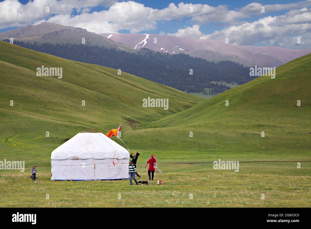Kazakh nomads setting their nomadic tent known as Yurt, in Assy Plateau, Kazakhstan Stock Photo