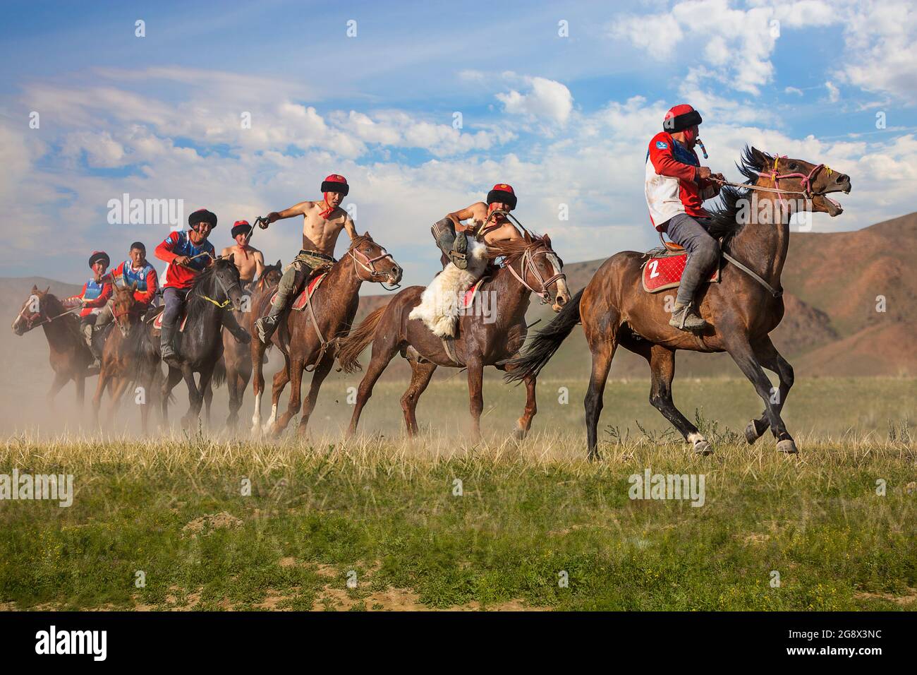 Nomad horse riders playing traditional horse game of Buzkashi known also as Kokpar, in Issyk Kul, Kyrgyzstan. Stock Photo