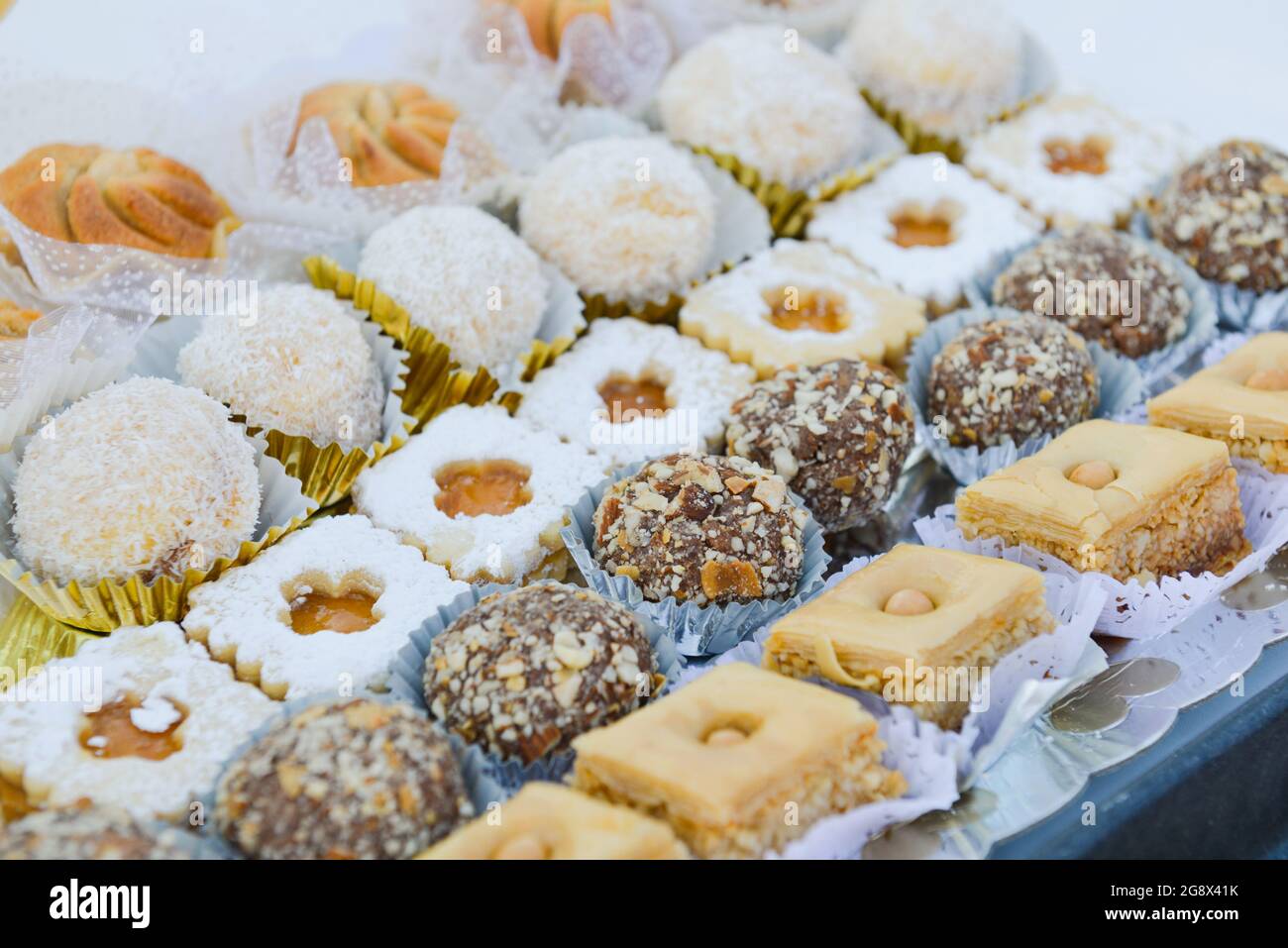 Assortment of traditional oriental pastries presented in a dish, filling the top view image Stock Photo