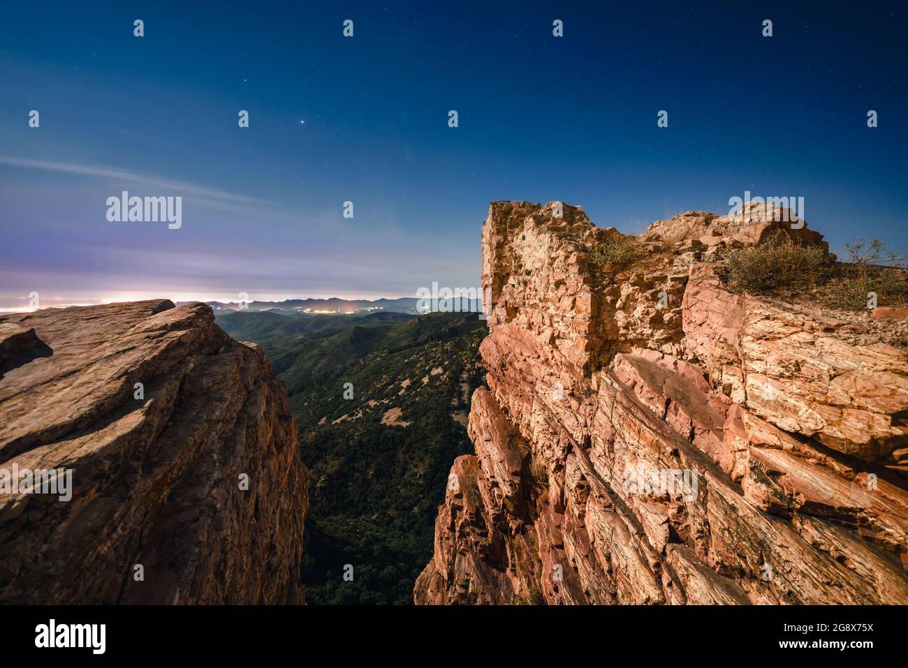 Starry night landscape in a ruined castle. Castillo de Castro, Spain. Stock Photo