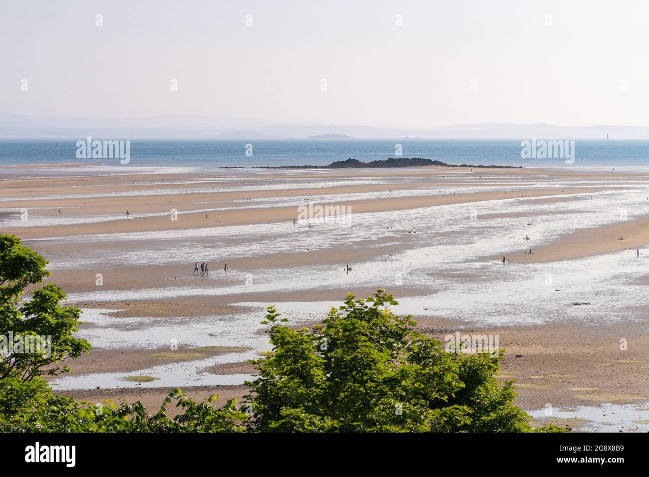 The Black Rock rocky islet between Burntisland and Kinghorn, Pettycur Bay, Firth of Forth, Fife, Scotland, UK at low tide Stock Photo