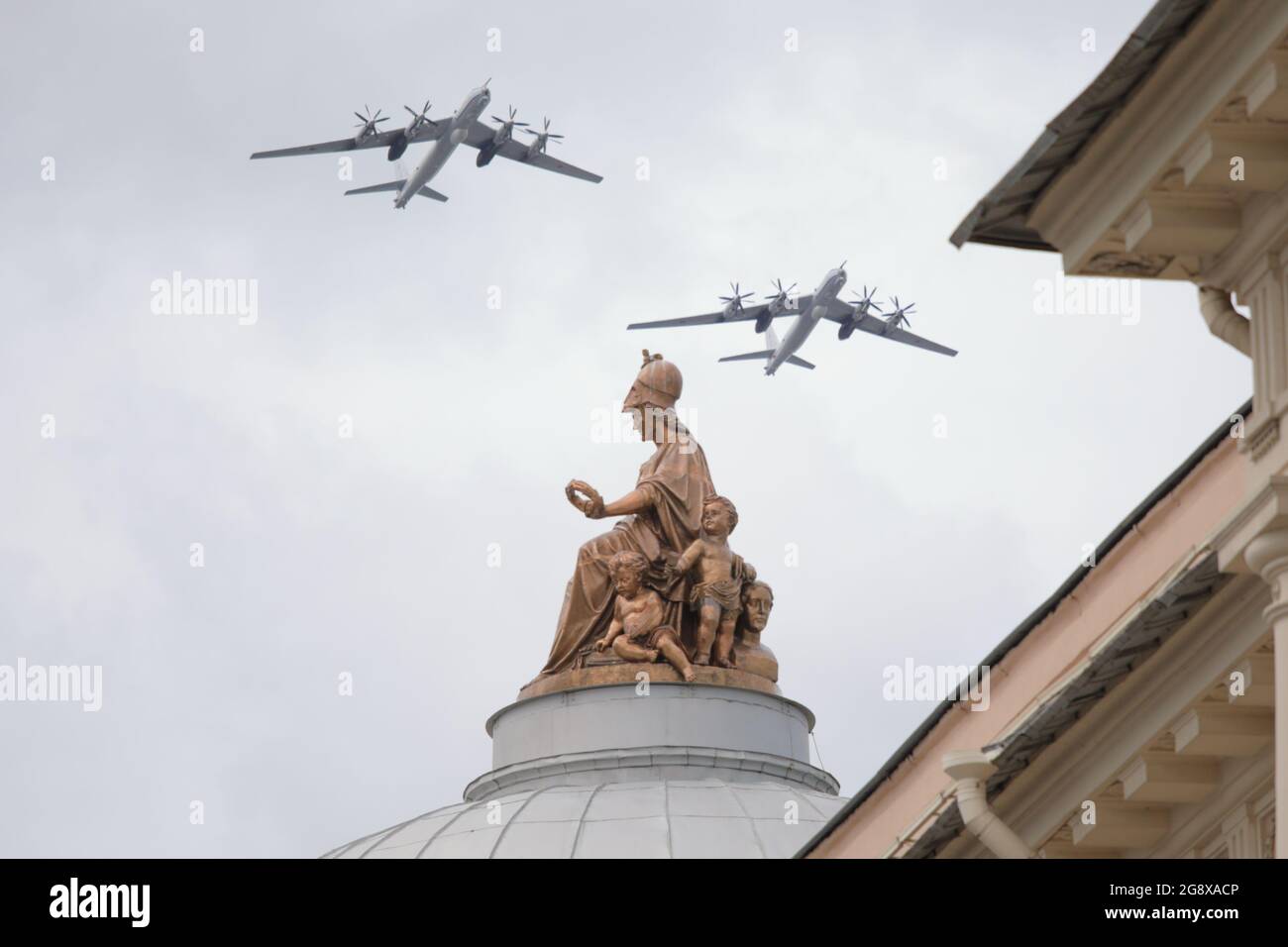 Tupolev Tu-142MZ Bear-F Russian maritime reconnaissance and anti-submarine warfare aircraft over the Minerva statue in St. Petersburg, Russia Stock Photo