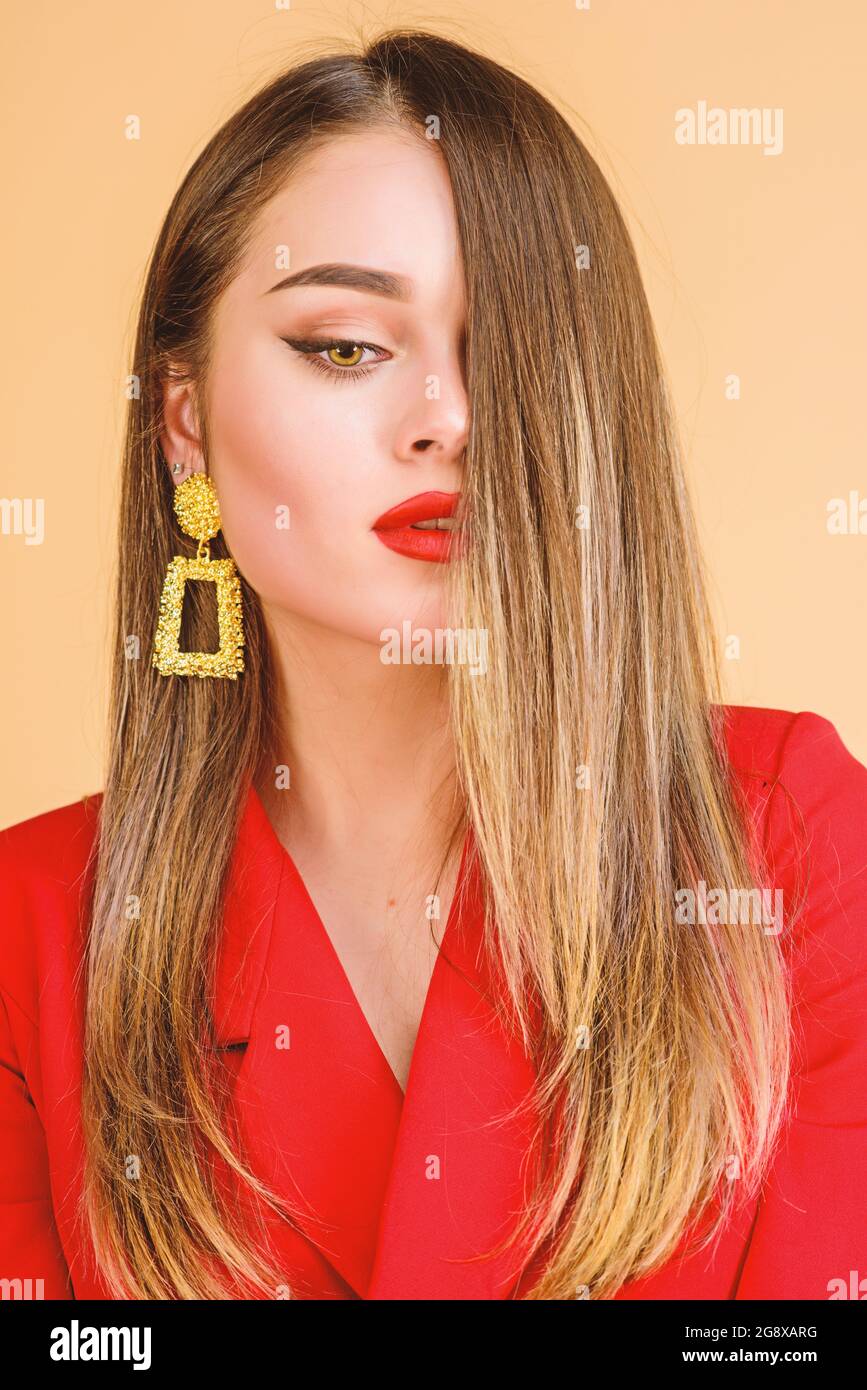 Impeccable makeup and perfect jewelry. Woman wear glamorous earrings.  Fashion trend. Jewelry shop. Girl model long hair demonstrating golden  jewelry Stock Photo - Alamy
