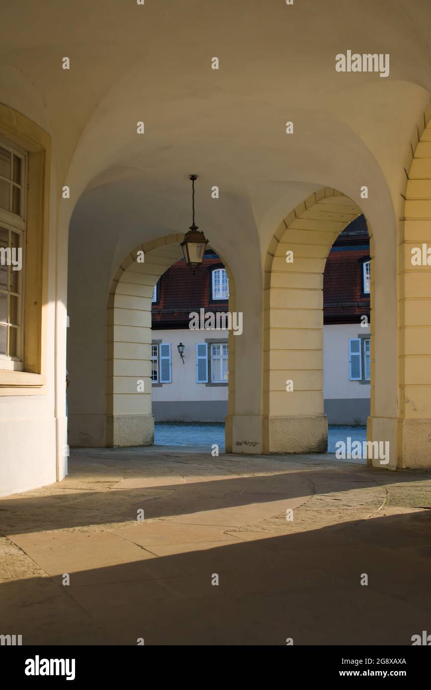 Light shines between columns of castle through, light and shadows ...