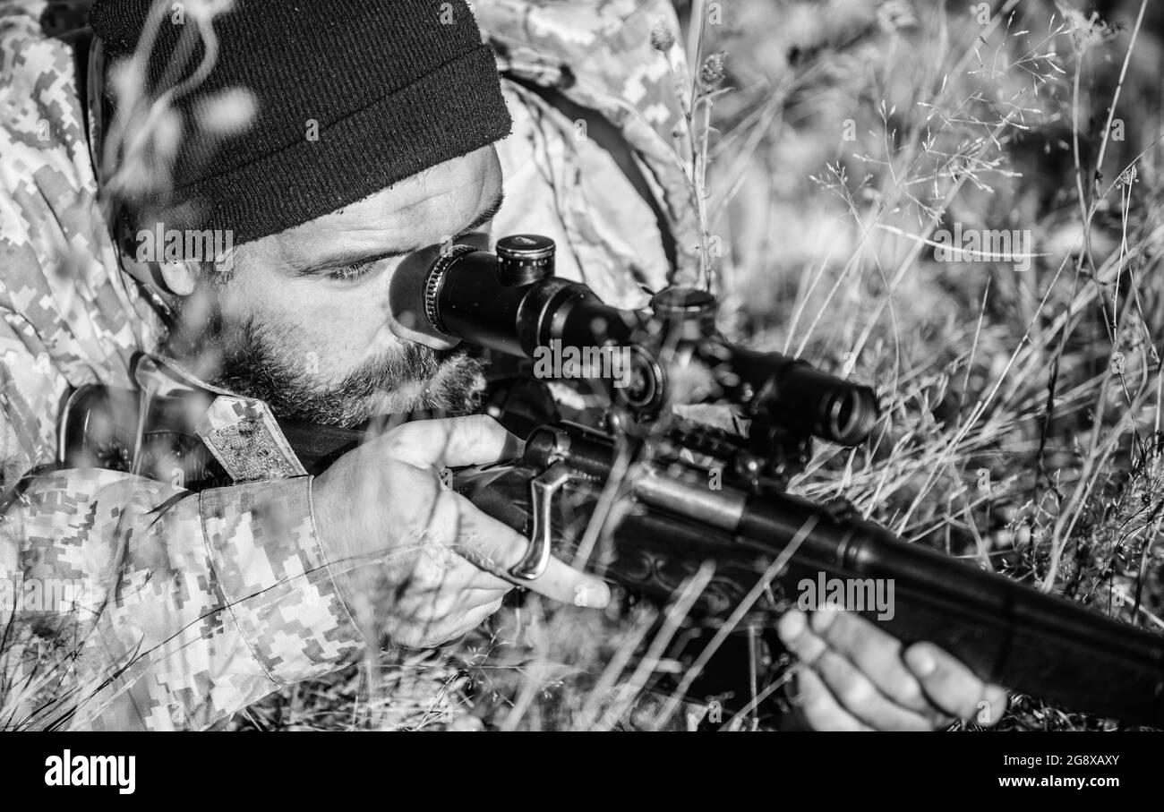 Bearded man hunter. Military uniform fashion. Army forces. Camouflage. Hunting skills and weapon equipment. How turn hunting into hobby. Man hunter Stock Photo