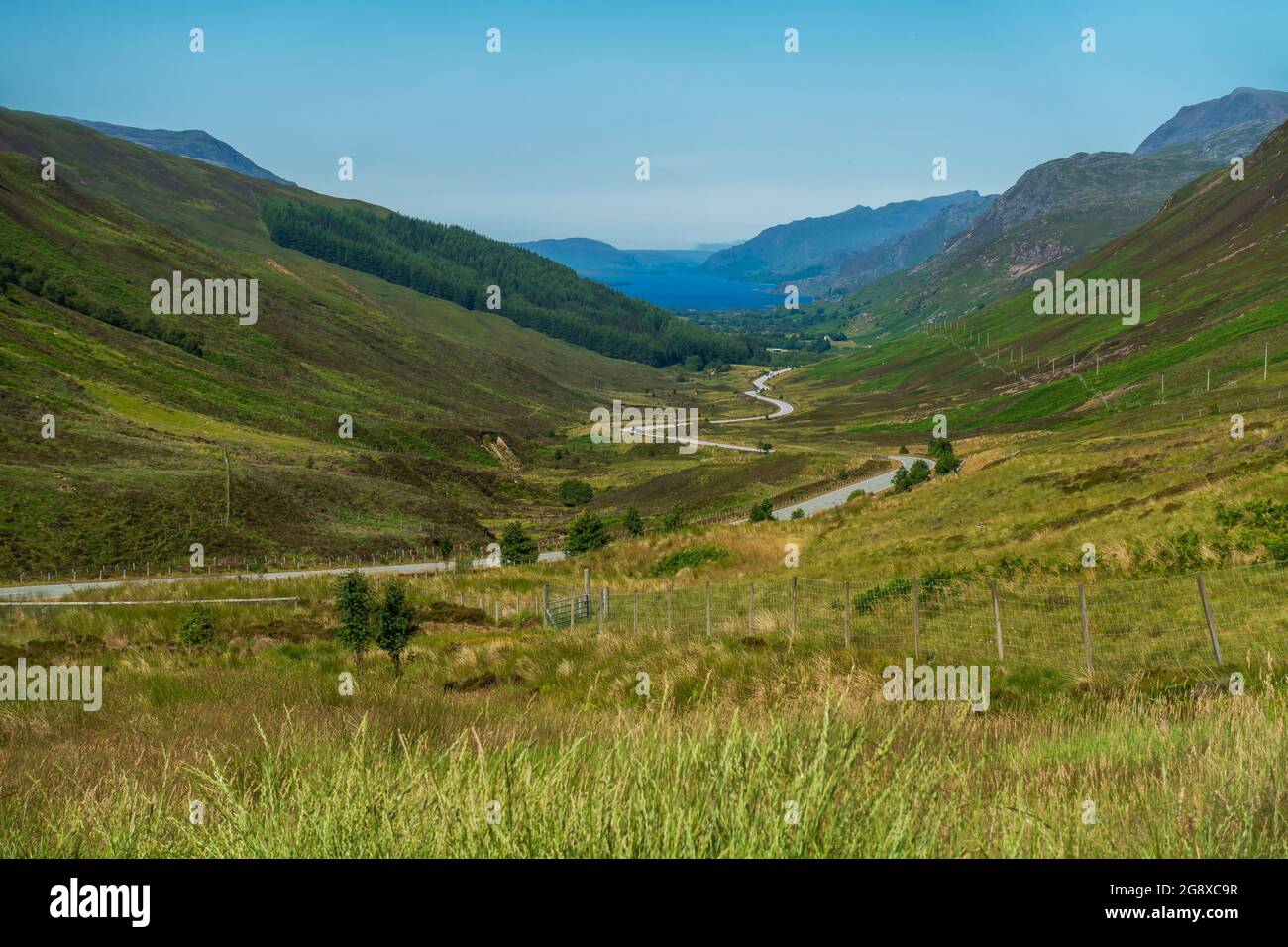 The view down Glen Docherty on the A832 road, with Loch Maree and Kinlochewe in the distance, Scotland Stock Photo