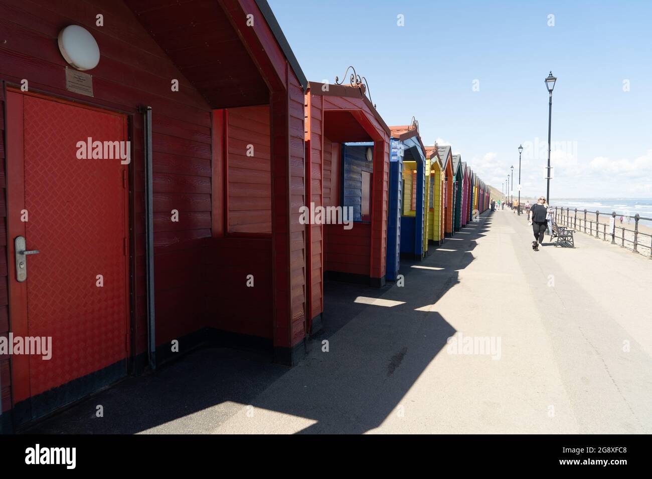 Long row of colourful beach huts in Saltburn Stock Photo