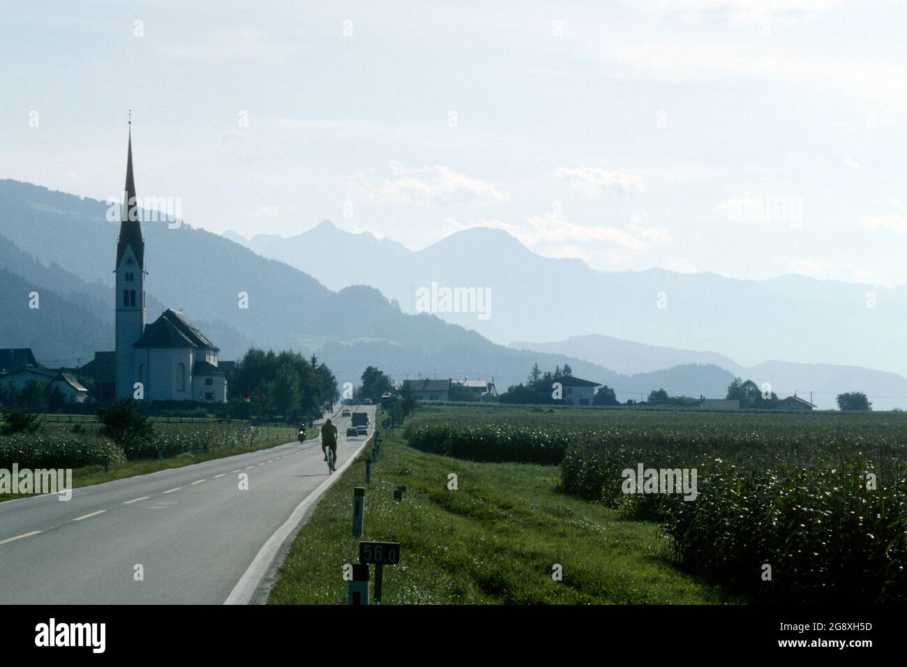 Parish church with mountain scenery behind in 1981, Schwaz, Tirol, Austria Stock Photo