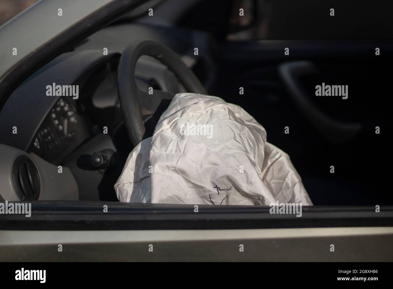 The airbag has deployed. Car after an accident. The driver's seat is