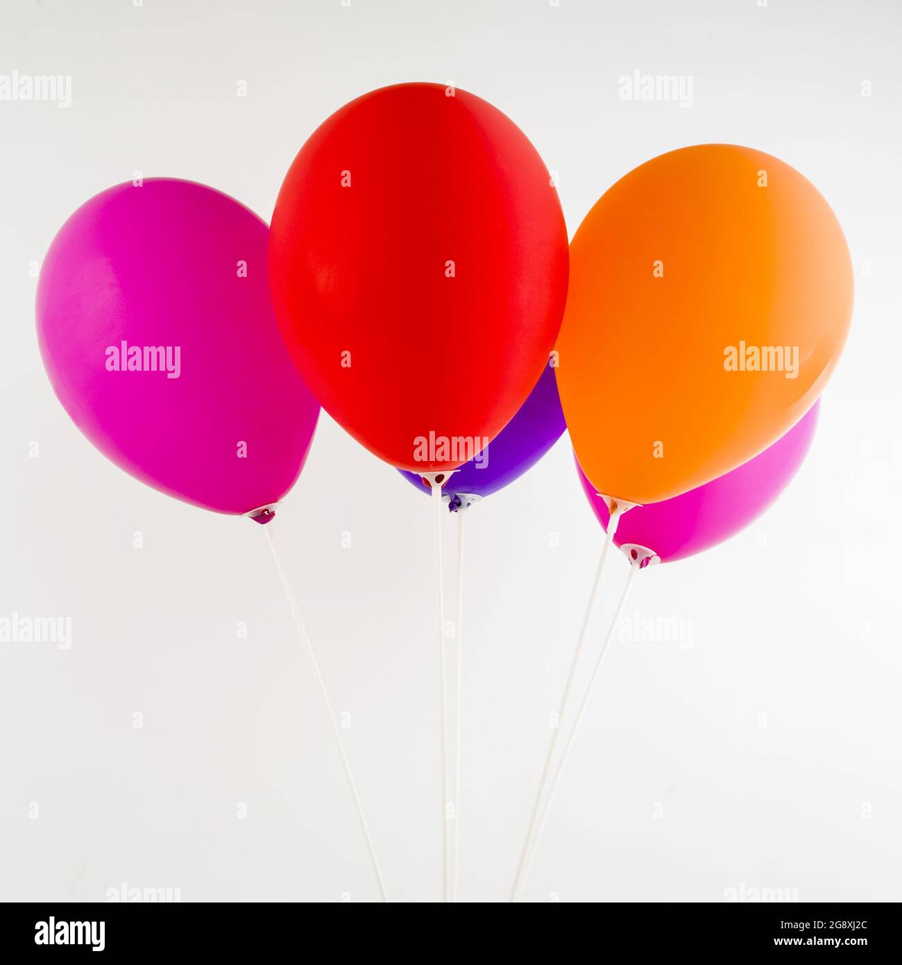 Bunch of colorful balloons isolated in white background Stock Photo - Alamy