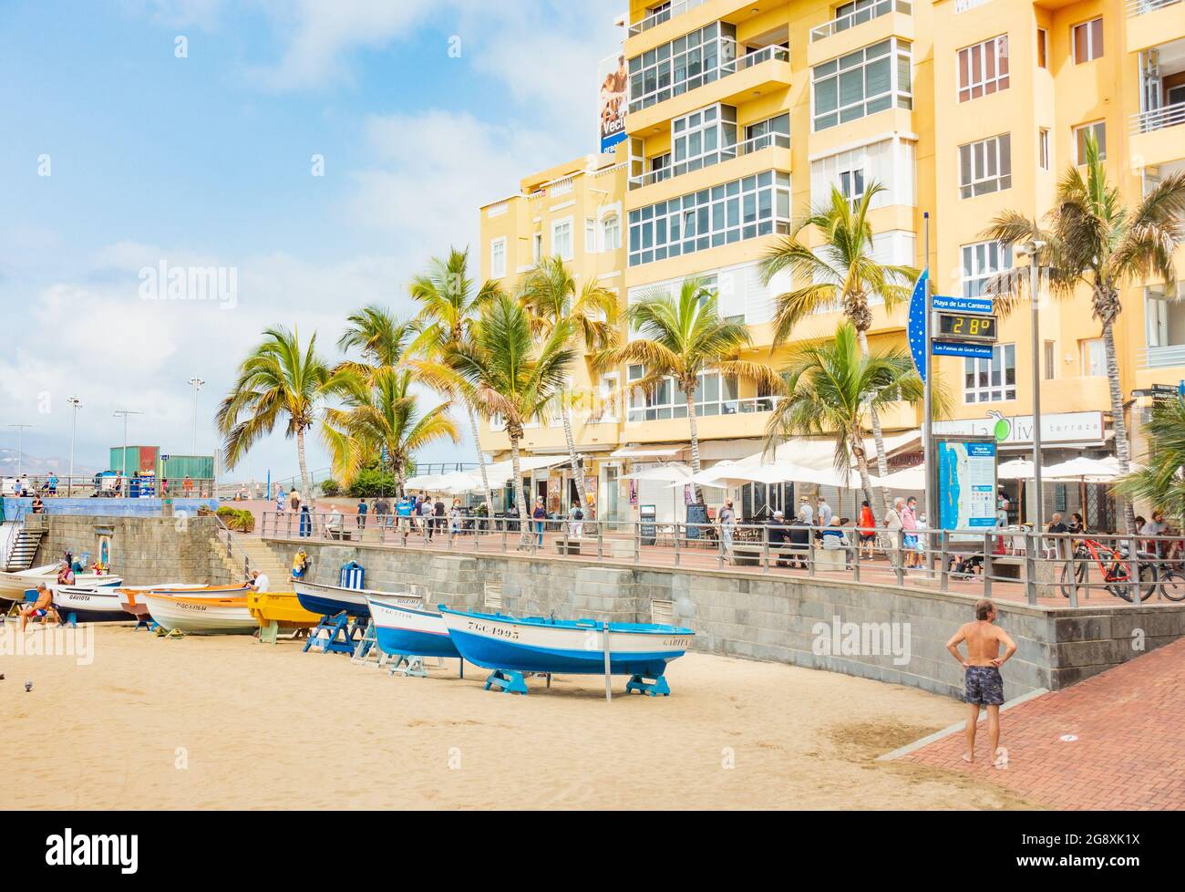 Las Palmas, Gran Canaria, Canary Islands, Spain. 23rd July, 2021. Locals  and tourists, many from the UK, on the city beach in Las Palmas on Gran  Canaria. Gran Canaria and Tenerife will