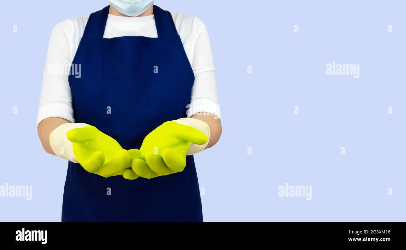 Consept cleaning service. A cleaning lady in green gloves Stock Photo Alamy