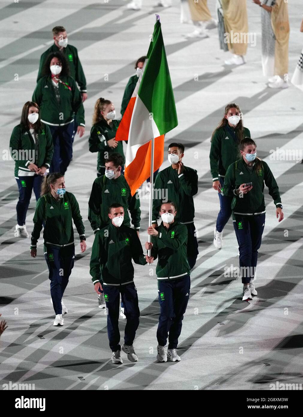 Ireland flagbearers Kellie Harrington and Brendan Irvine lead out the ...