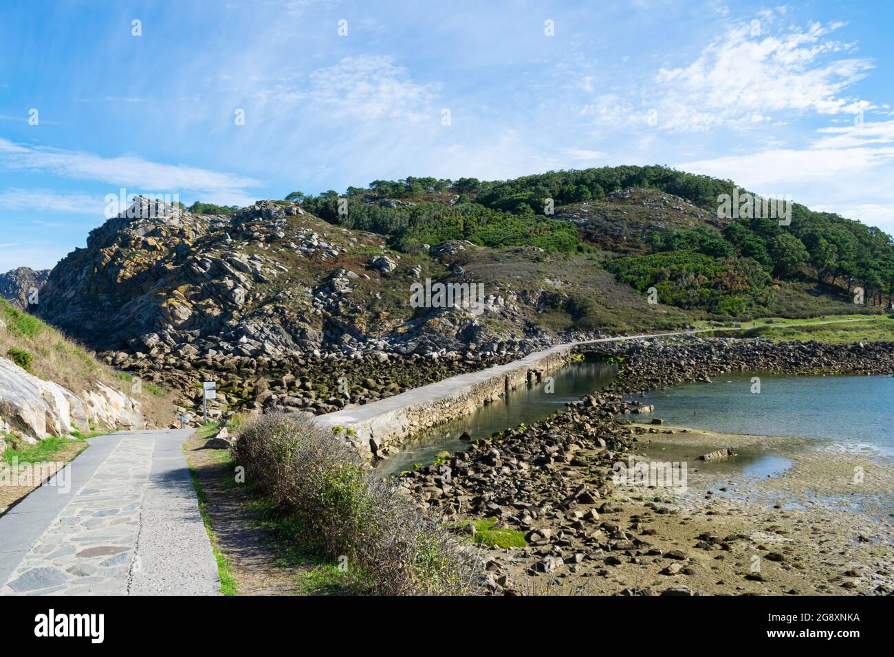 Stone bridge connecting the Cies islands in Galicia - Spain Stock Photo