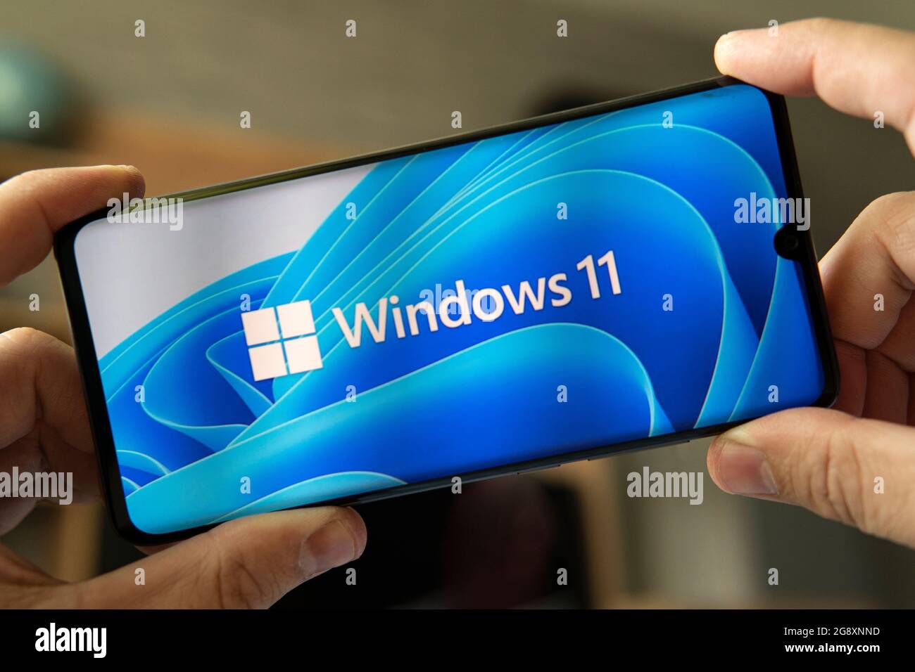 June 23, 2021. Barnaul, Russia. The logo of the new Windows 11 operating system on the smartphone. Stock Photo