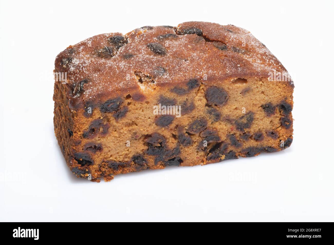 A small fruit cake. A mix of currants, raisins and other dried fruit with flour and egg and baked in an oven to make a moist fruit cake. Stock Photo