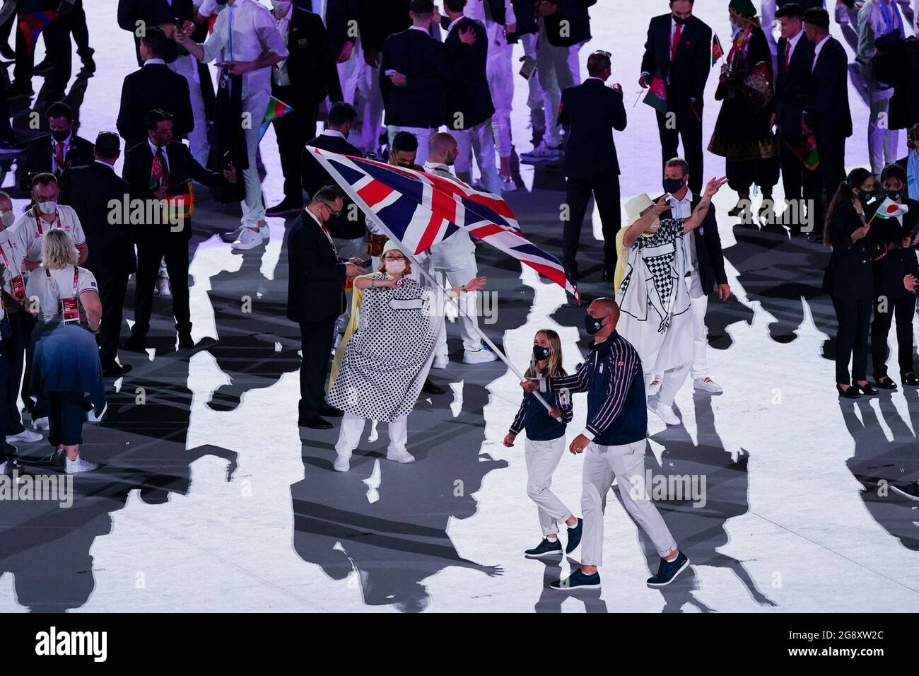 Tokyo, Japan. 23rd July, 2021. TOKYO, JAPAN - JULY 23: Flag bearers Hannah Mills and Mohamed Sbihi of Team Great Britain leads their team out during the Opening Ceremony of the Tokyo 2020 Olympic Games at the Olympic Stadium on July 23, 2021 in Tokyo, Japan (Photo by Ronald Hoogendoorn/Orange Pictures) NOCNSF Credit: Orange Pics BV/Alamy Live News Stock Photo