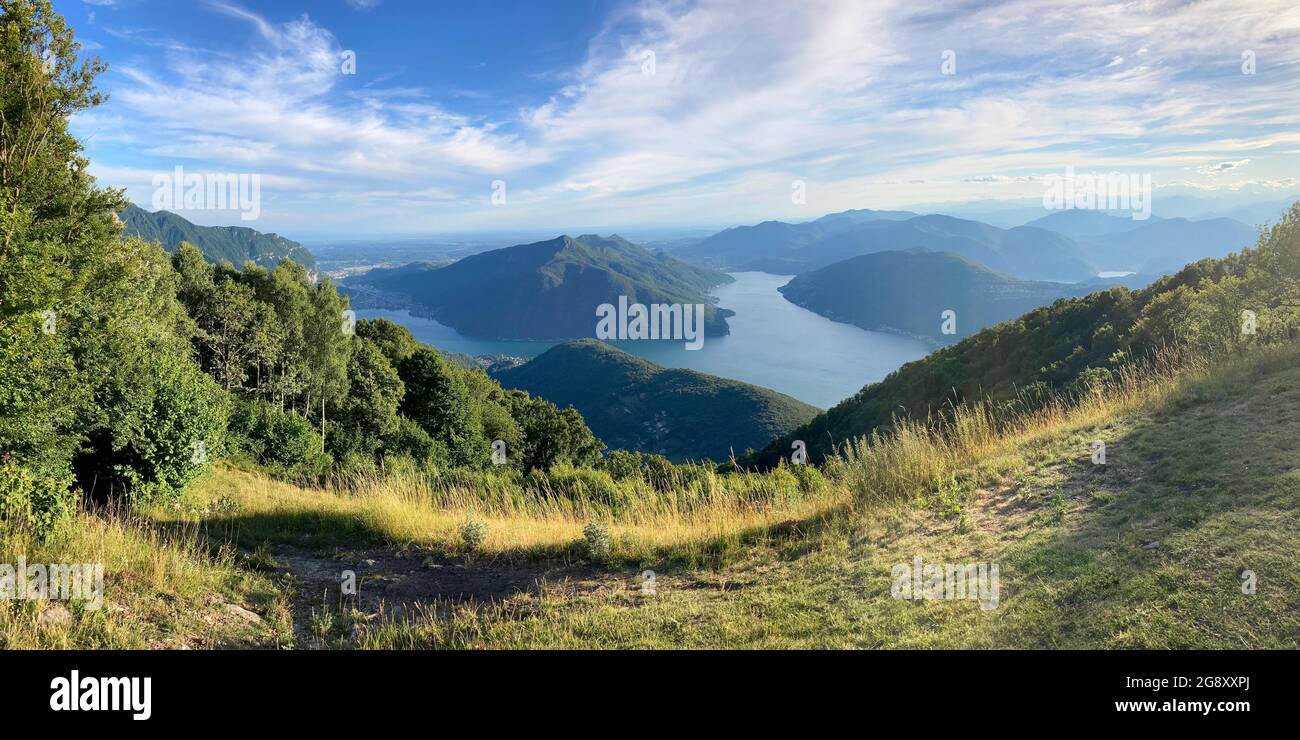 Beautiful panoramic view on the Lugano Lake and the Mendrisiotto region from Monte Sighignola on the border of Italy and Switzerland on a sunny day Stock Photo