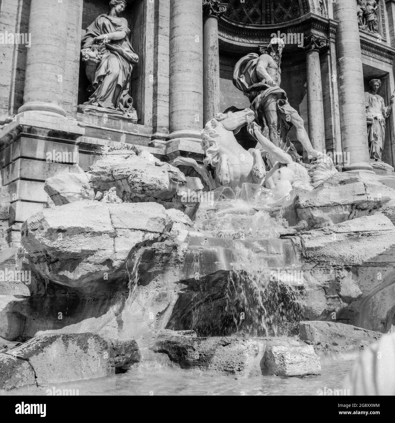 Rome, 1972: detail of the left side of famous Trevi Fountain, made famous in Fellini's film 'La dolce vita', with the bathroom scene of the actress Anita Ekberg Stock Photo